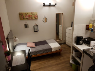 Espace lit et cuisine Espace lit et cuisine