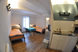 Espace cuisine et lits Espace cuisine et lits